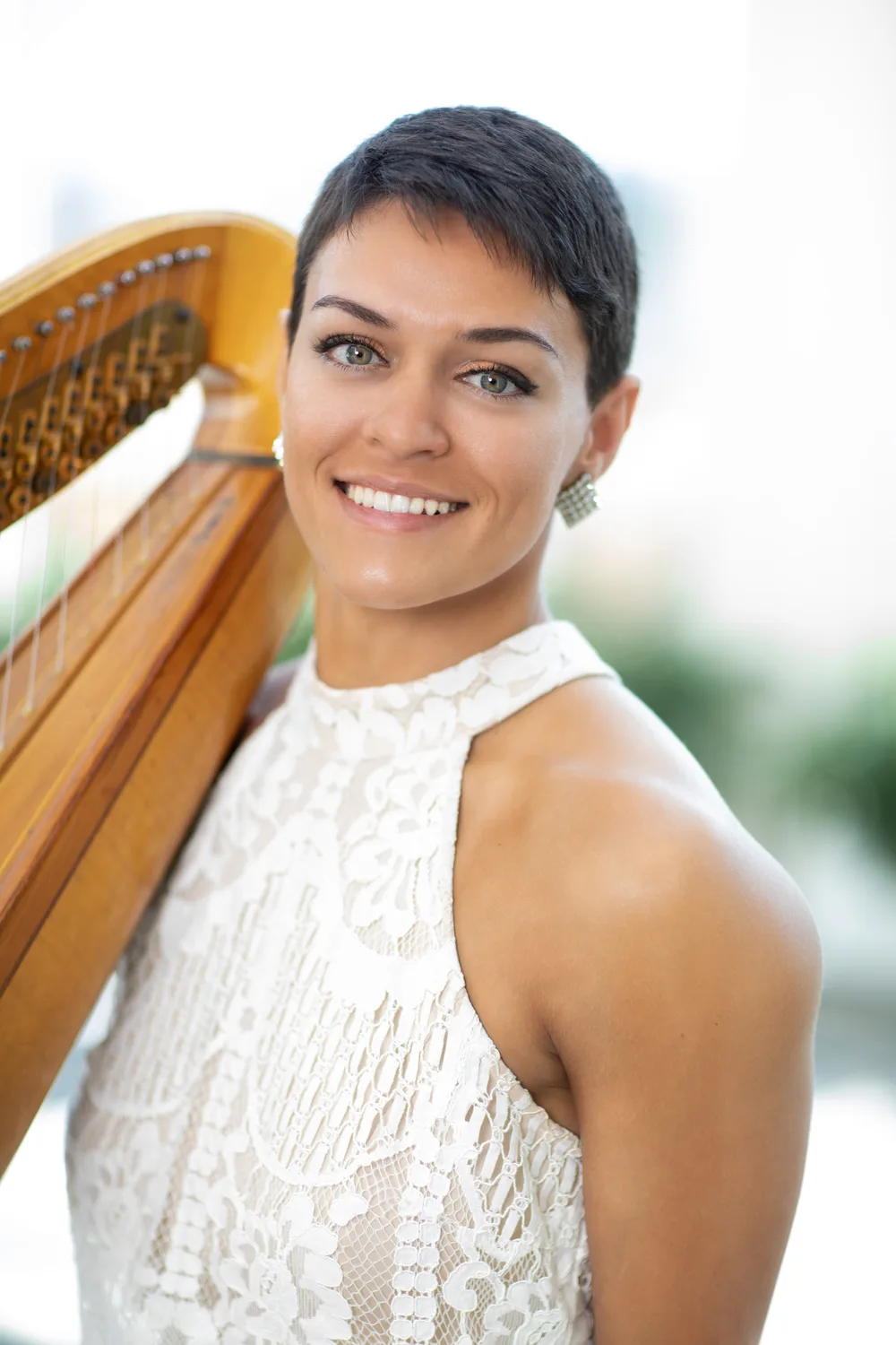 Victoria Greer, harpist, with her harp